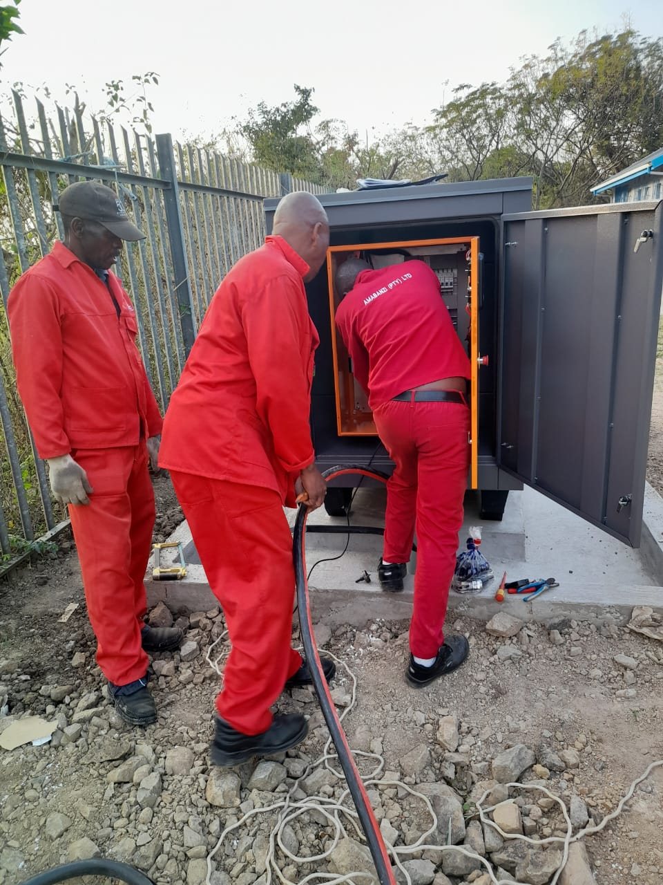 Amabanzi team working at equipment site